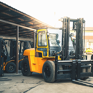 Forklift trucks lined up with heavy leader in front